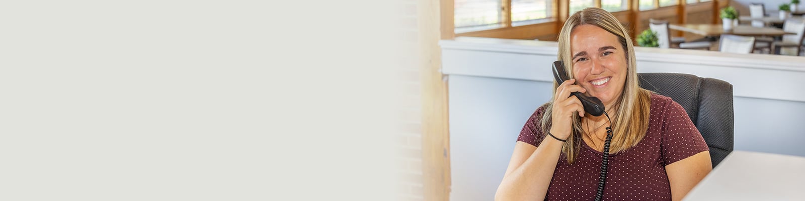 Buckeye Care receptionist smiling while on the phone