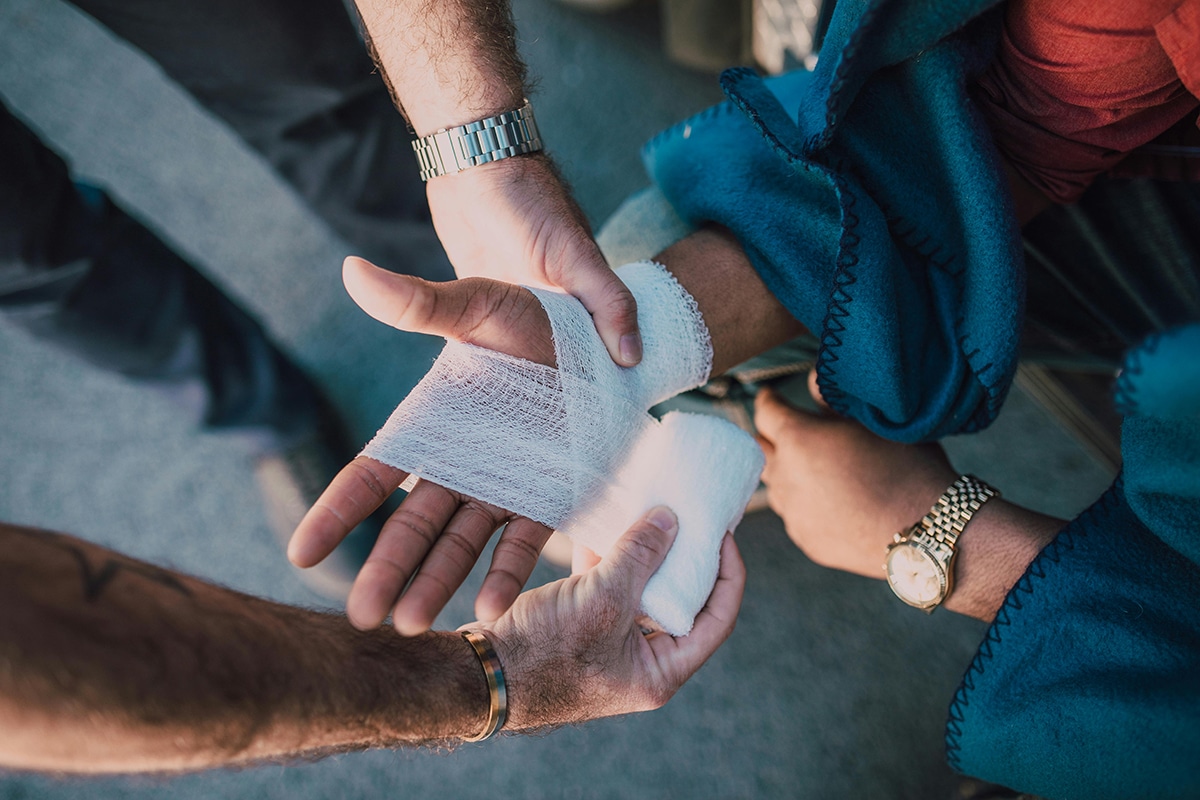 patient getting hand properly bandaged
